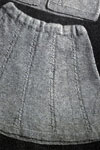 skirt with drawn cables pattern